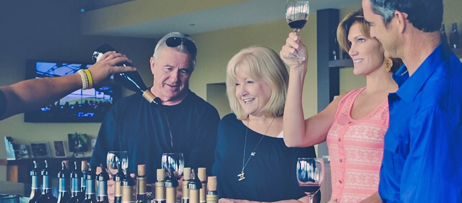 Two couples tasting red wine in Paso Robles