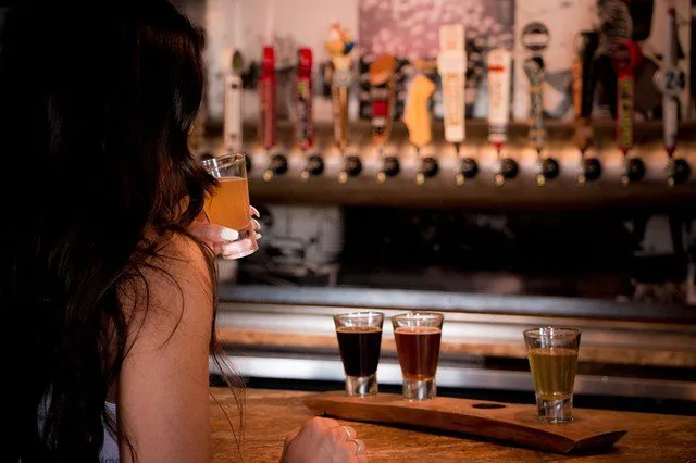 Girl tasting flight of beers at Temecula Brew Pub