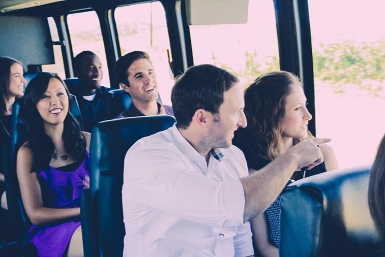 Couples aboard wine tour bus