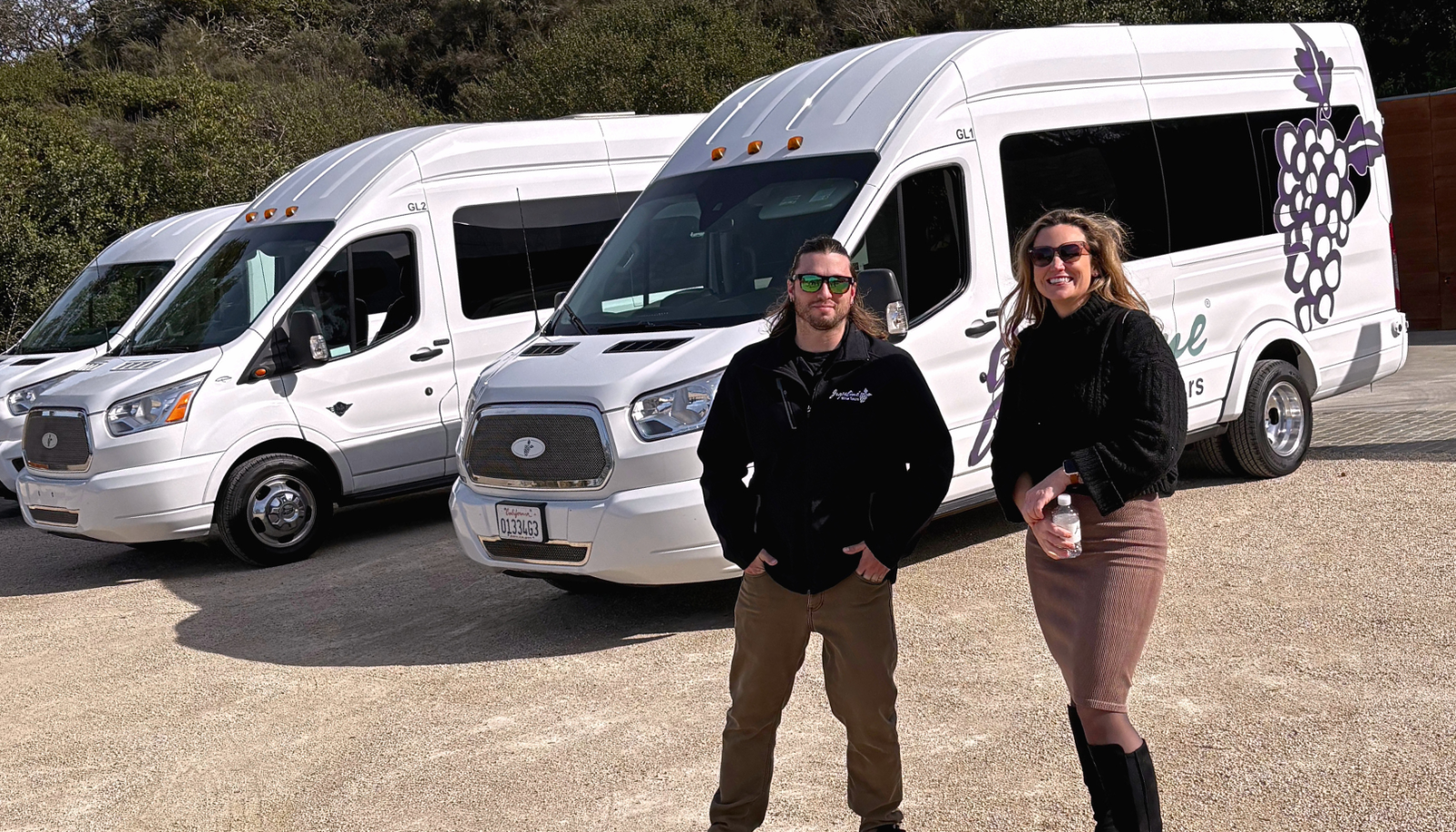 Tour guide with a guest, showing around wine country.
