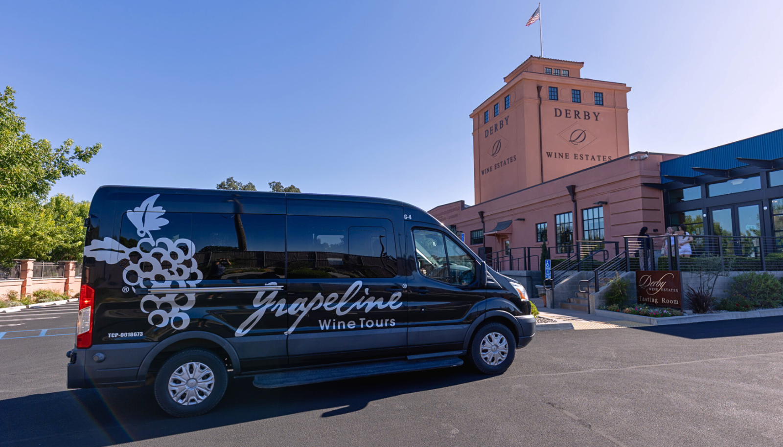Grapeline touring vehicle in front of Derby Winery Estates.