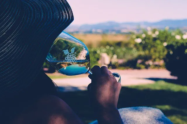 Girl tasting white wine out of Grapeline wine glass at Ponte Vineyard Inn