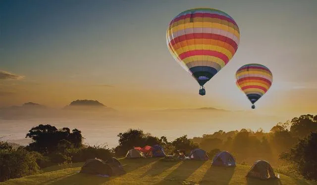 Hot Air Balloons Above Campsite