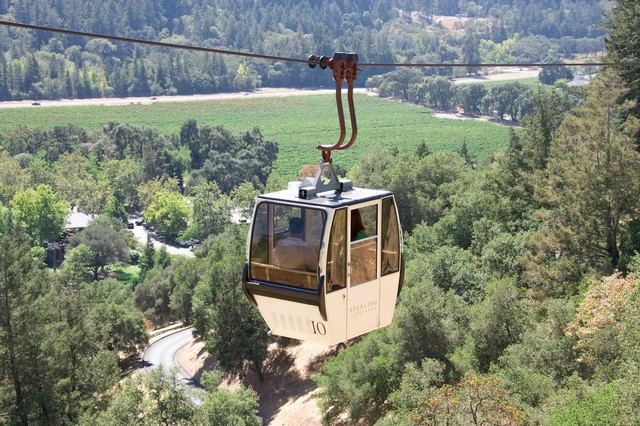Gondola in Napa Valley's Sterling Vineyards lifts guests with a scenic view of vineyards and greenery