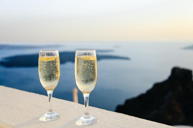 Two Wine Glasses filled with Bubbly Brüt overlooking a Beautiful Pacific Ocean