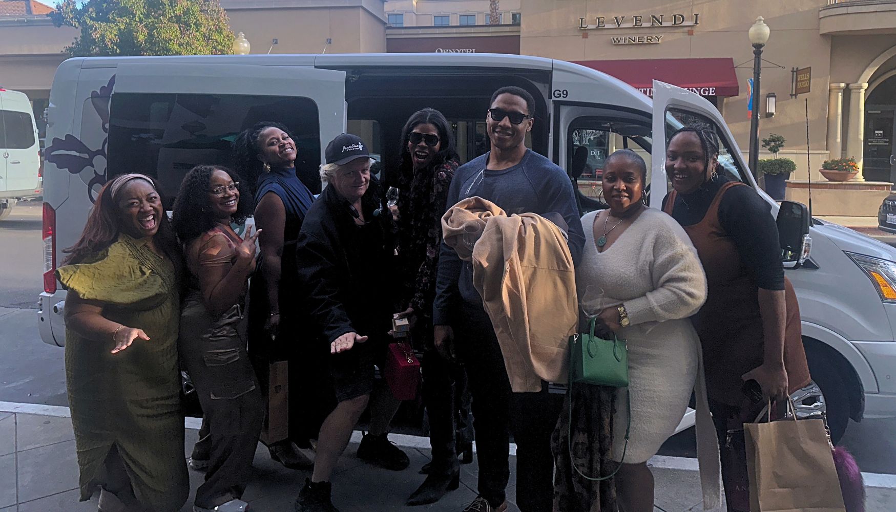 Passengers boarding an airport transfer shuttle.